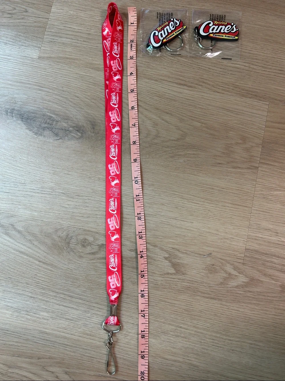 Raising Cane's Red Logo Lanyard with 2 Raising Cane’s Keychains bundle NEW
